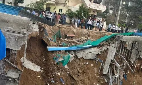 A portion of road caves in, locals blames illegal building A portion of road caves in, locals blames illegal building