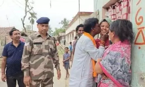 BJP MP Khagen Murmu Caught in Controversy Over Campaign Kiss