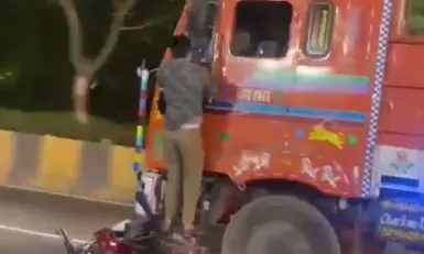 Two trucks catch fire after collision, driver injured on NH 63