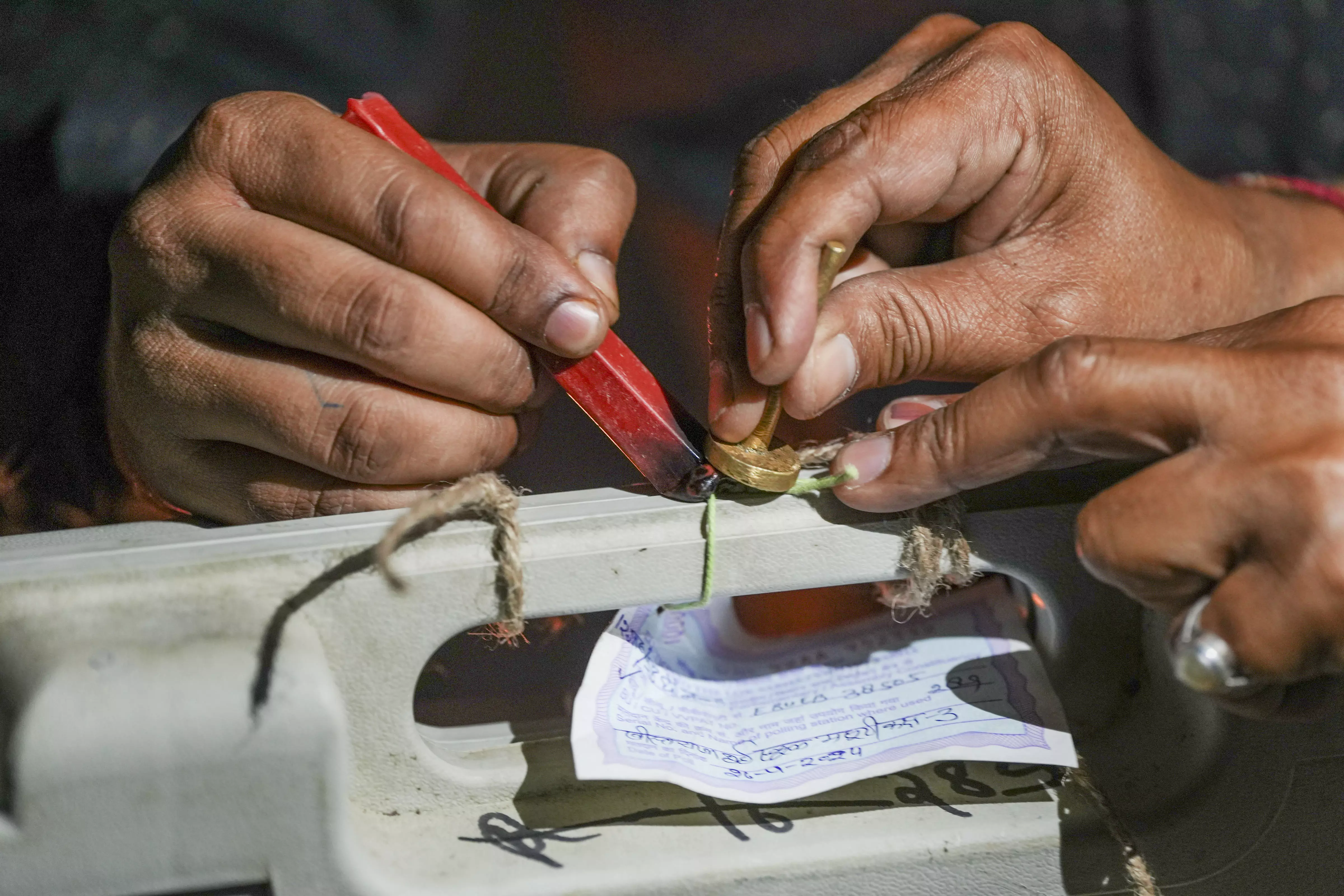 Man tries to break EVM with axe Man tries to break EVM with axe