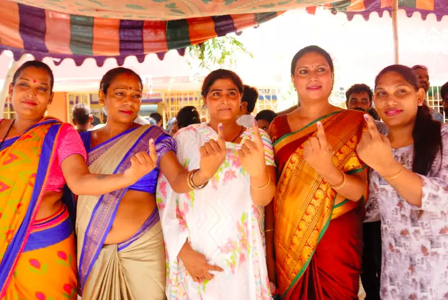 A group of transgender show their ink mark after casting their vote at Subbarao Nagar municipal school in Rajamahendravaram on Monday.  - A.MANIKANTA KUMAR