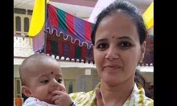 New mother turns up at Secunderabad polling booth with her baby New mother turns up at Secunderabad polling booth with her baby