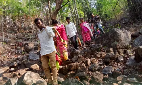 AP: Villagers carry elderly woman to polling station in Alluri Seetharama Raju District