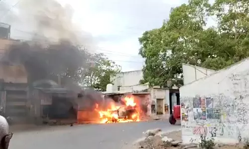 Tensions Rise in AP as YSRCP Activists Set Car on Fire, Vandalize TDP Office Tensions Rise in AP as YSRCP Activists Set Car on Fire, Vandalize TDP Office