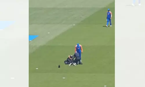 Watch: Fan breaches security to meet Rohit, NY police step-in Watch: Fan breaches security to meet Rohit, NY police step-in