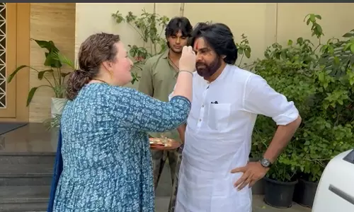 Pawans wife Anna gives harathi to winner