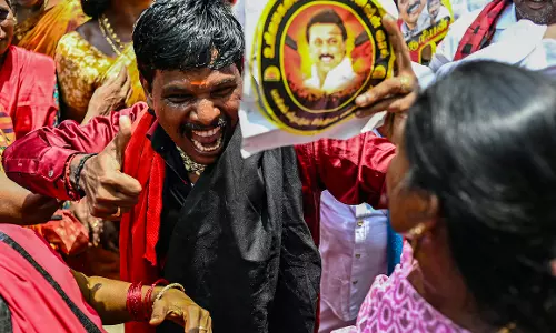DMK cadre breaks into celebrations DMK cadre breaks into celebrations