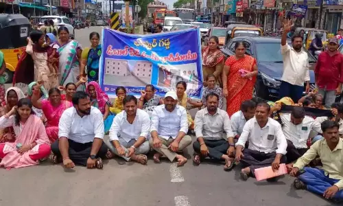 Beneficiaries Hold Rasta Roko for 2BHKs in Bhupalpally