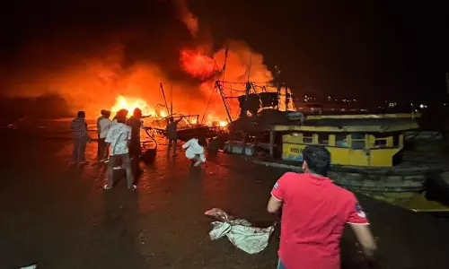 Fishing boat catches fire off Vizag; crew rescued