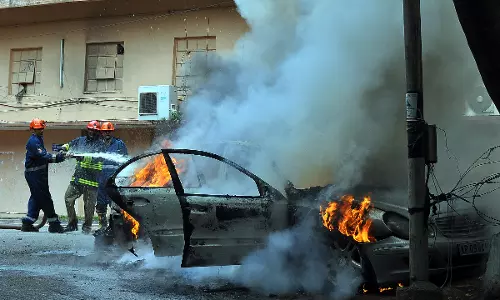 Car catches fire near LB Stadium