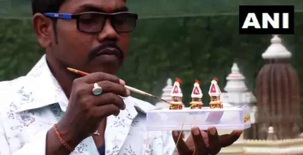 Odisha miniature artist crafts eco-friendly two-inch chariot on the commencement of Jagannath Rath Yatra Odisha miniature artist crafts eco-friendly two-inch chariot on the commencement of Jagannath Rath Yatra