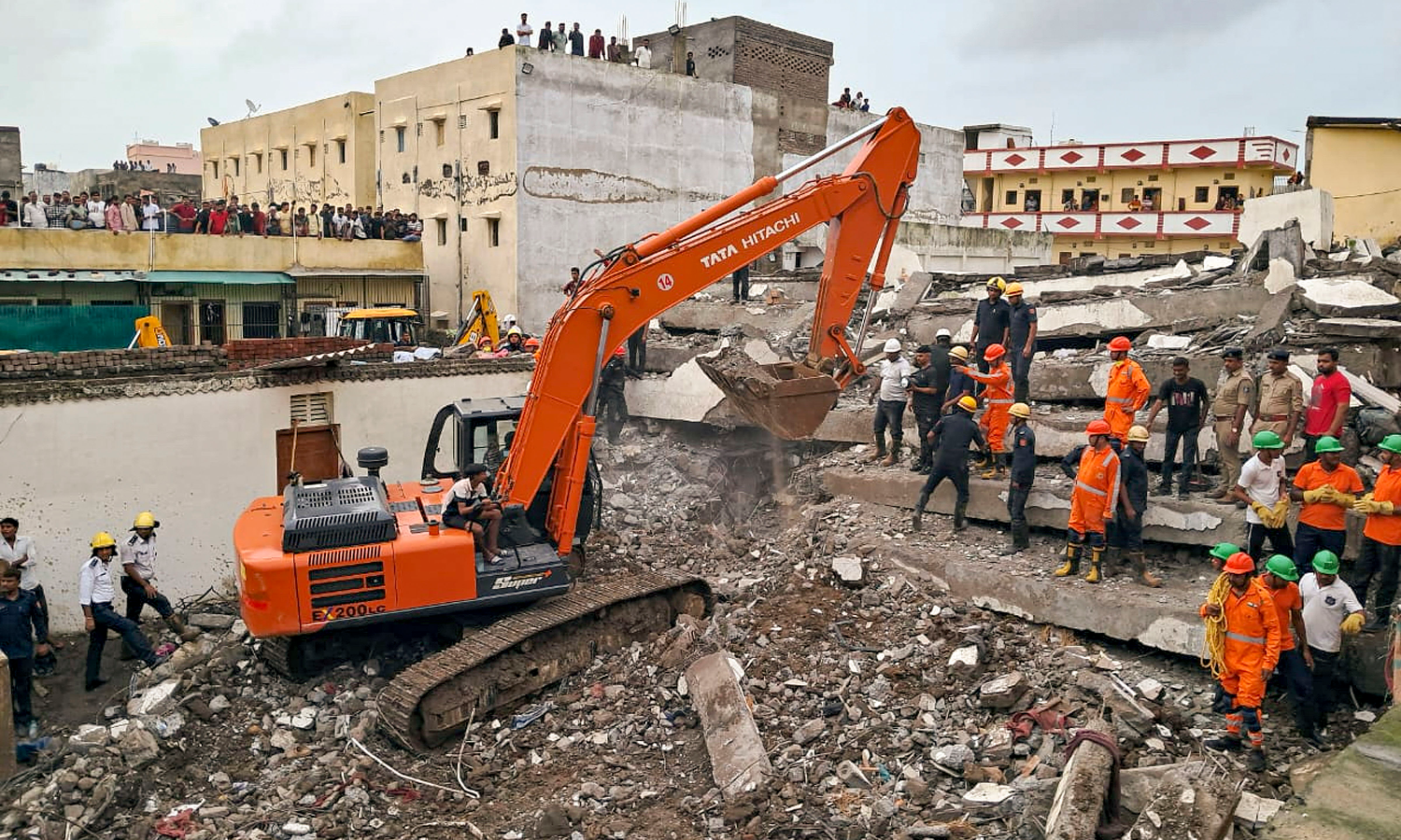 Seven killed in Surat building collapse, woman rescued alive Seven killed in Surat building collapse, woman rescued alive