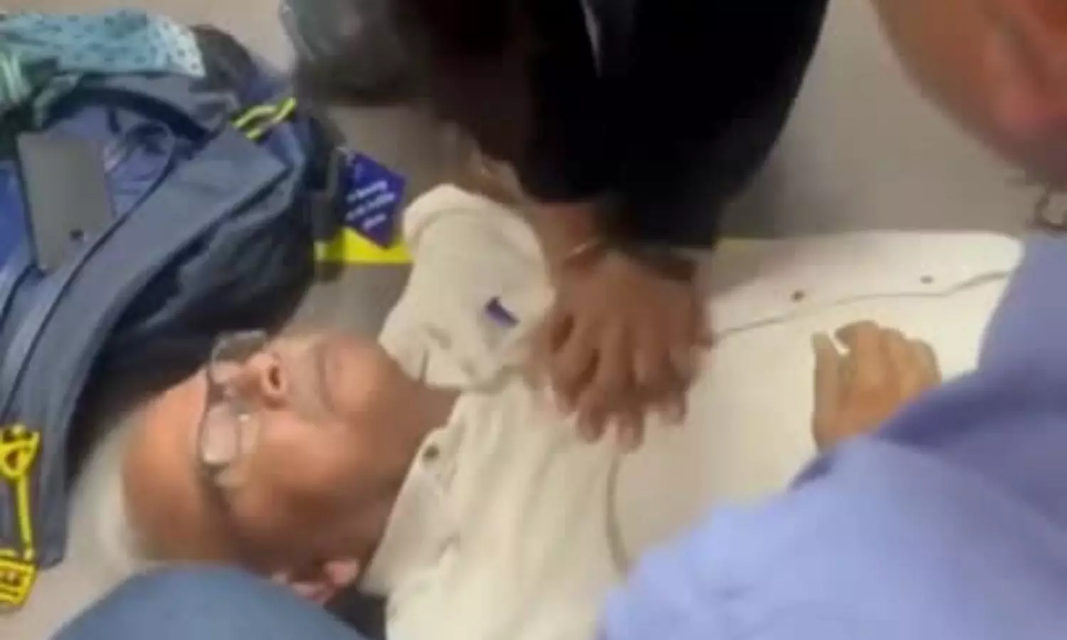 Doctor performs CPR to elderly passenger at Delhi airport Doctor performs CPR to elderly passenger at Delhi airport