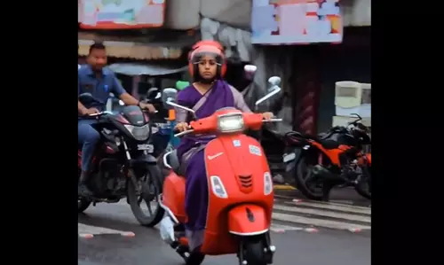 Women MLA on Scooty to meet people in constituency