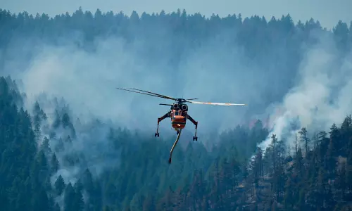 Wildfires in Colorado burn dozens of homes and structures, threaten hundreds more