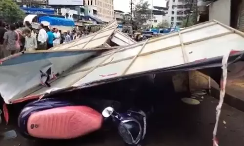 3 vehicles crushed as hoarding collapses in Thane district