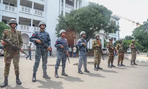 Bangladesh interim govt urges protesters to surrender all illegal firearms within a week