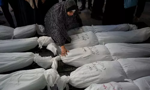Corpses buried in streets, tiered graves as Gaza death toll passes 40,000