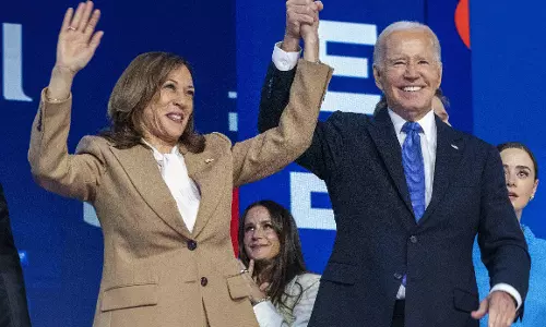 Biden passes the baton to Harris, says she will be a historic president