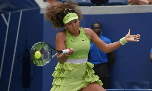 Naomi Osaka puts a bow on US Open return Naomi Osaka puts a bow on US Open return