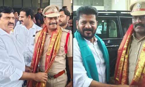 Revanth Reddy felicitates two CIs for providing timely help to railway passengers in Mahabubabad