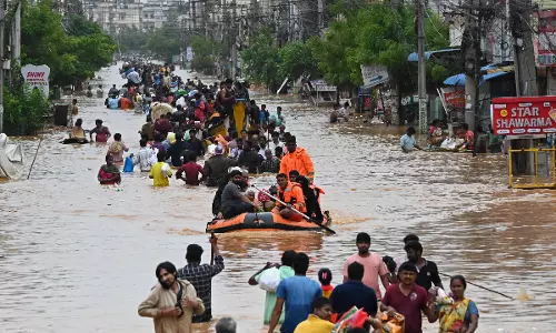 Nellore MPs Donate Rs 1.5 Crore for AP, Telangana Flood Relief