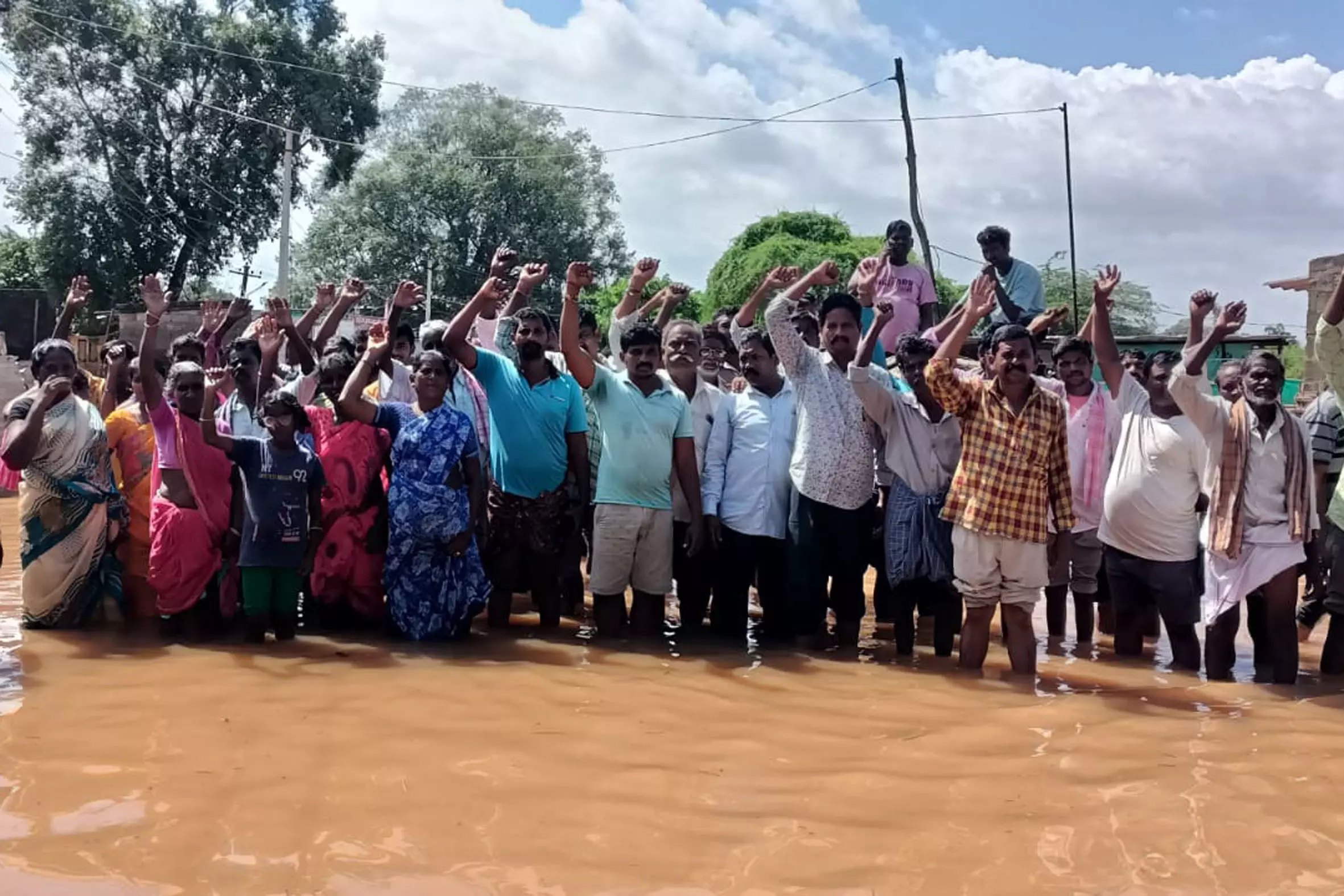Polavaram Project Oustees Hold Protest in Knee-deep Water, Demand Relief Polavaram Project Oustees Hold Protest in Knee-deep Water, Demand Relief