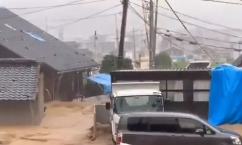Japan orders evacuations as heavy rains trigger floods in quake-hit area