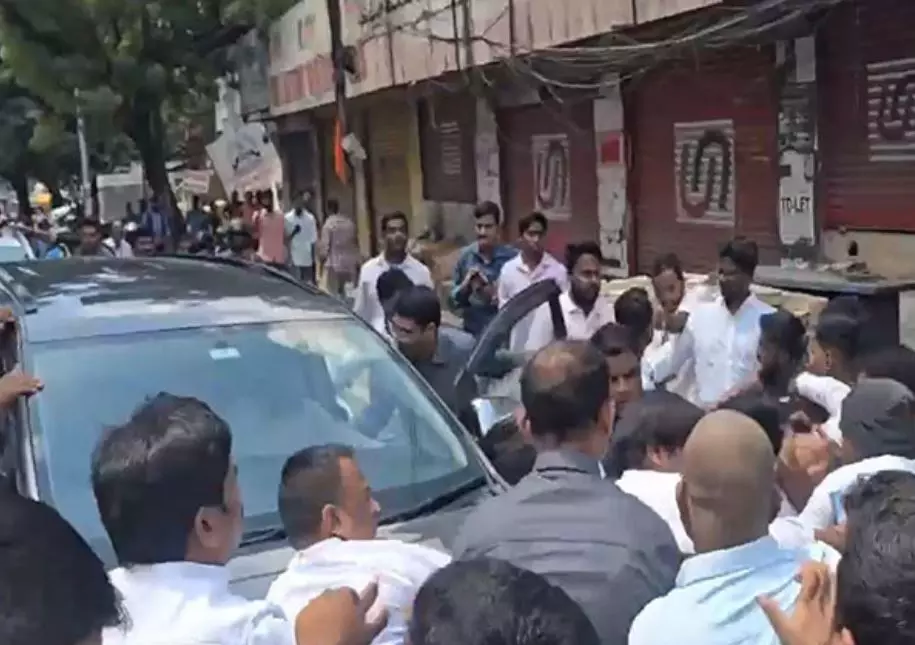 KTR Car Stormed by Cong Workers While on Musi Visit KTR Car Stormed by Cong Workers While on Musi Visit