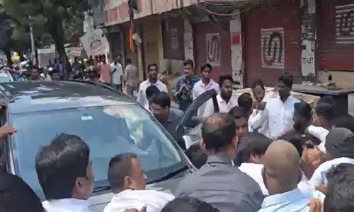 KTR Car Stormed by Cong Workers While on Musi Visit KTR Car Stormed by Cong Workers While on Musi Visit