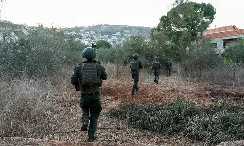 Hezbollah steps up rocket fire as Israel sends more troops into Lebanon