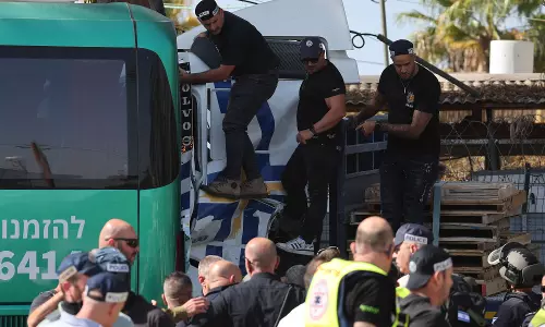 Israeli strikes on Gaza kill 22, officials say, as truck ramming near Tel Aviv hurts dozens