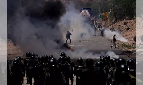 Supporters of Bolivian ex-president storm military barracks, take soldiers hostage