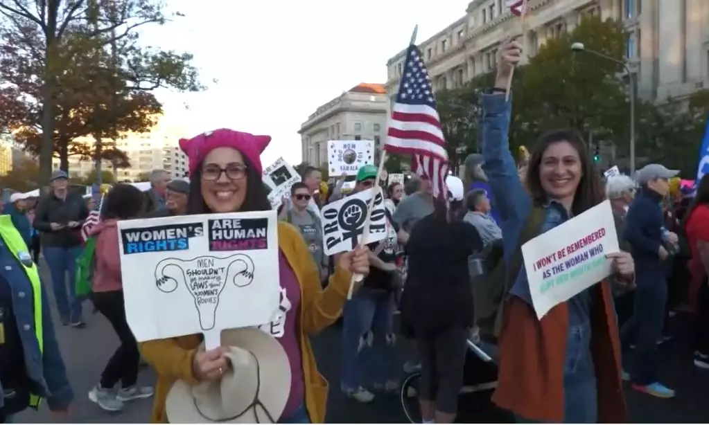 Womens march protesters gather to Kamala Harris