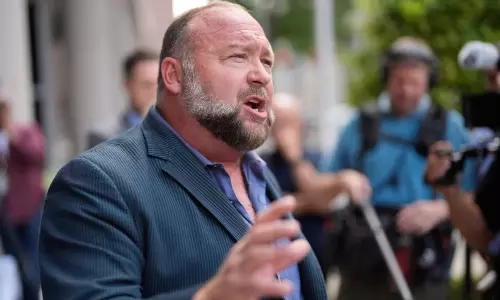 Satire publication The Onion buys Alex Jones Infowars at auction with Sandy Hook families backing