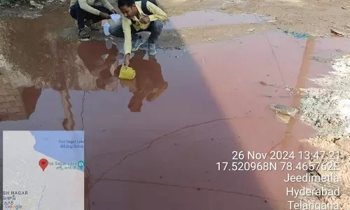 Red water flowing on road alarms Venkatadrinagar residents