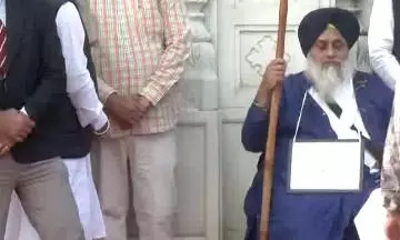 Sukhbir Badal, with plaque around neck, undertakes Akal punishment at Golden Temple Sukhbir Badal, with plaque around neck, undertakes Akal punishment at Golden Temple