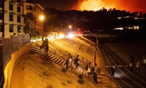 Homes burn as wind-driven wildfire prompts evacuations in Malibu, California
