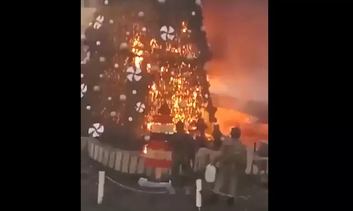 Farrukh Dhondy | As world rejoices at Christmas time, Xmas tree burnt in protest in Syria Farrukh Dhondy | As world rejoices at Christmas time, Xmas tree burnt in protest in Syria