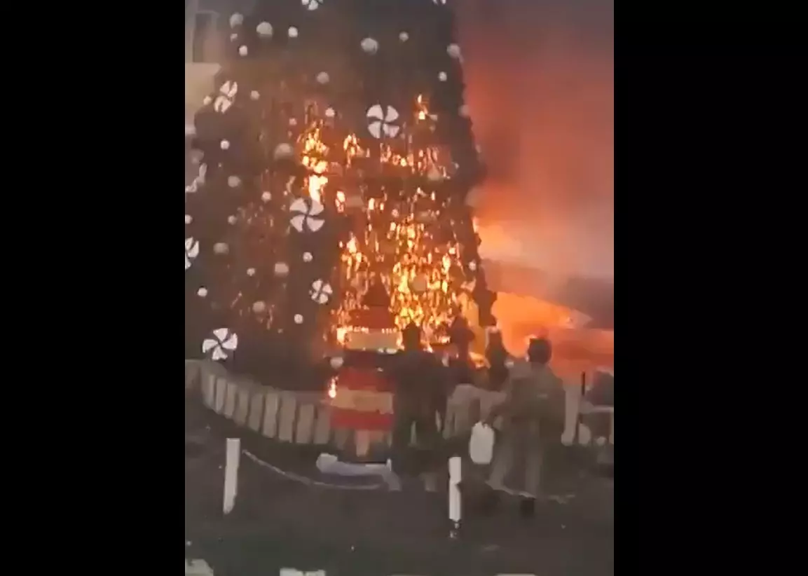 Farrukh Dhondy | As world rejoices at Christmas time, Xmas tree burnt in protest in Syria Farrukh Dhondy | As world rejoices at Christmas time, Xmas tree burnt in protest in Syria