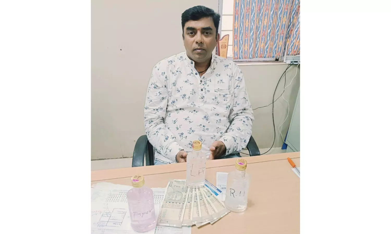 Koti ENT hospital employee held in bribe case Koti ENT hospital employee held in bribe case