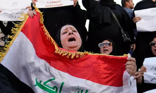 Iraqi lawmakers pass a bill that critics say legalizes child marriage