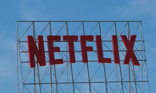 Netflix reports surge in subscribers, new price hikes