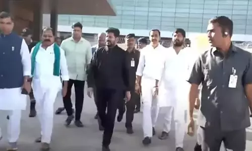 Revanth Reddy returns to Hyderabad after successful Davos tour