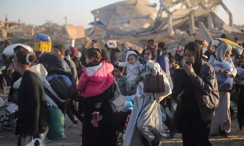 Palestinians celebrate their return to northern Gaza after 15 months of war