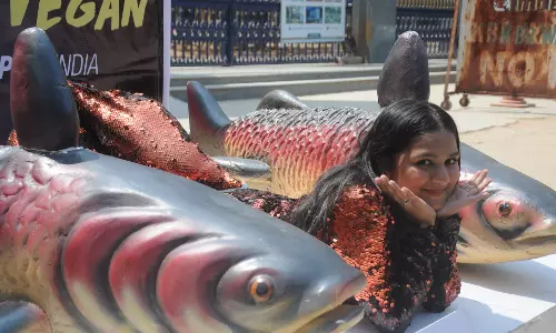 PETA India supporter stages protest against inhumane killing of fish