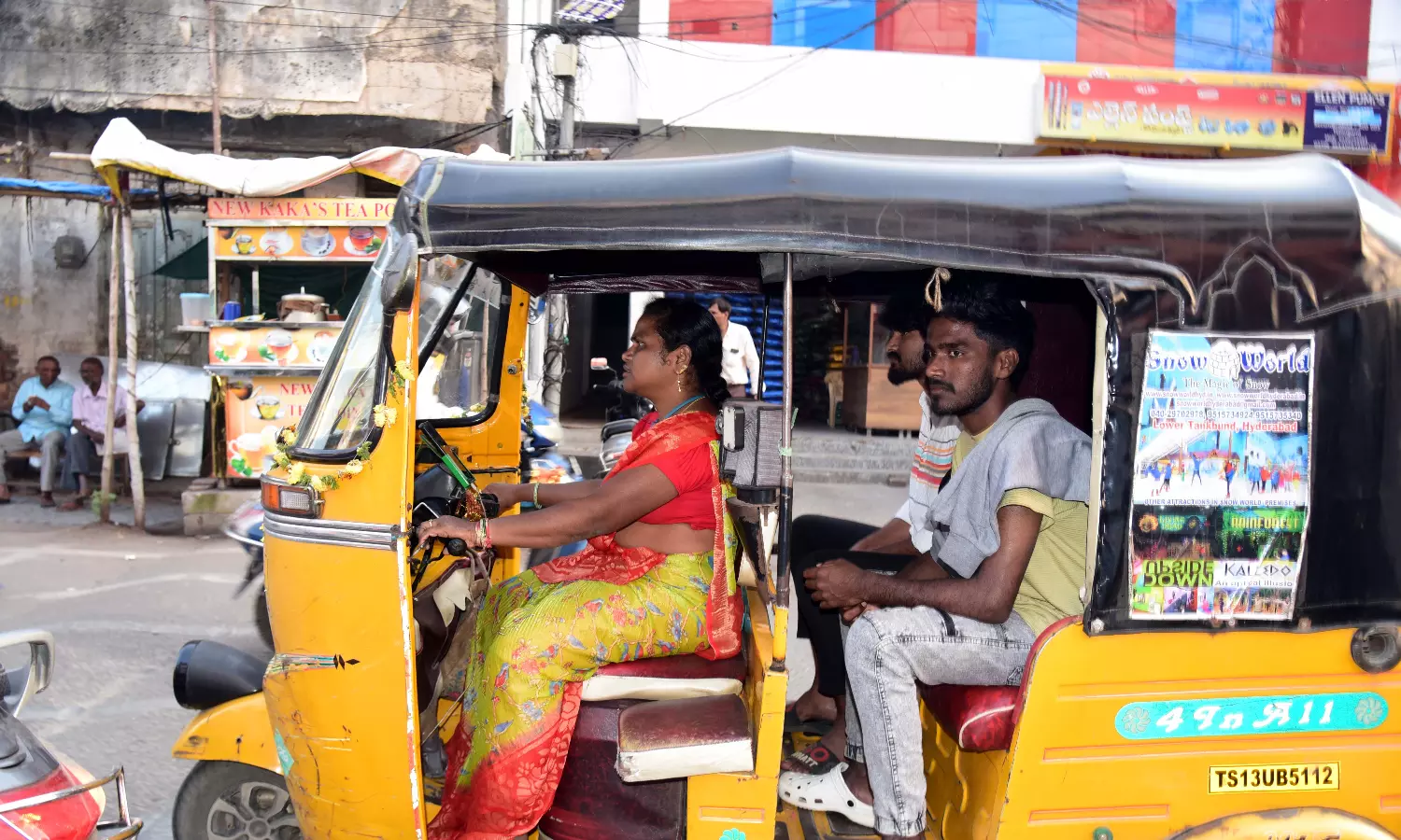 Woman dares all odds to drive auto Woman dares all odds to drive auto