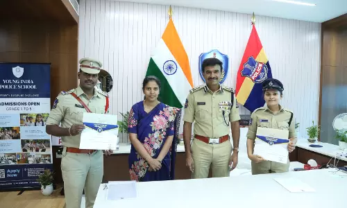 Anand pats two cops for good job