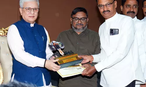 Governor fetes two award-winning DC photographers