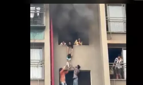Woman dangles kids from fourth floor during fire mishap in Ahmedabad apartment